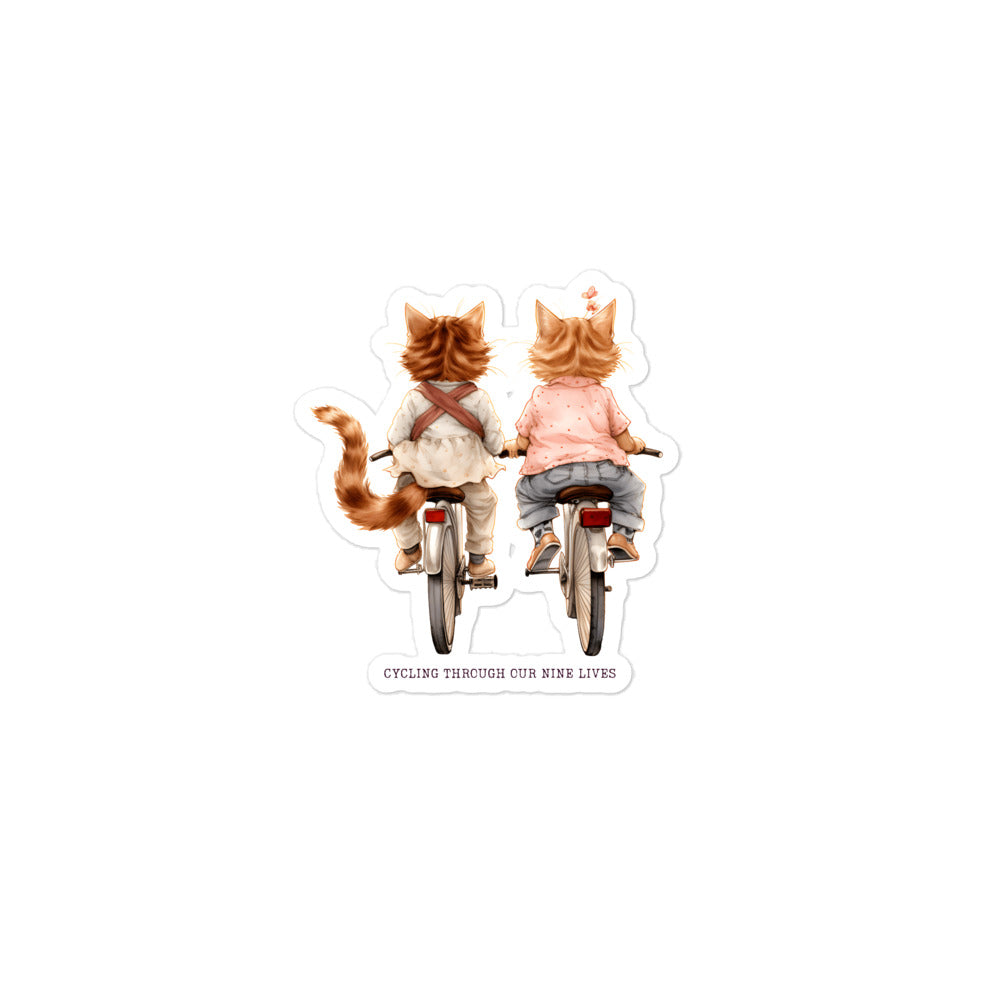 Cycling Through Nine Lives: Cute Cat Duo Sticker